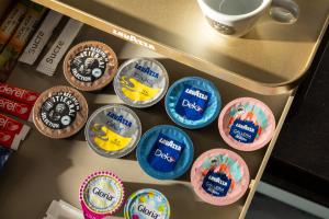 a group of cupcakes on a shelf in a refrigerator at Hôtel du Plat d'Etain in Paris