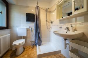 a bathroom with a toilet and a sink at Alla Casa Medievale in Cividale del Friuli