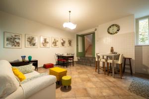 a living room with a couch and a table at Alla Casa Medievale in Cividale del Friuli +5 photos