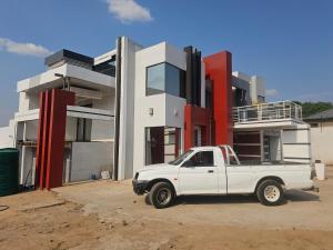 a white truck parked in front of a building at Turfloop guest house in Ga-Mothapo