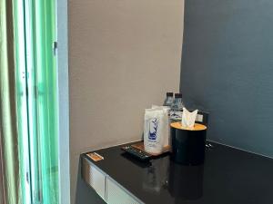 a counter in a room with a bottle of toothpaste at Wang nam yen hill วังน้ำเย็นฮิลล์ in Ban Mai