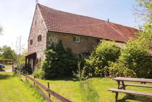 a brick building with a bench in front of it at Ingerichte safaritent in Saint-Priest-en-Murat +17 photos