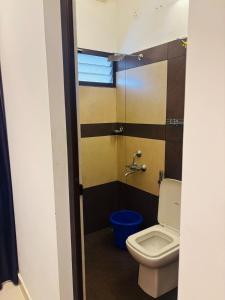 a bathroom with a toilet and a sink at Love shore in Cochin