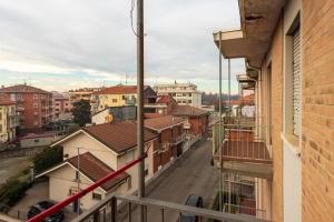a view of a city from the balcony of a building at Bicocca Urban Suite - SELF CHECKIN WIFI in Novara