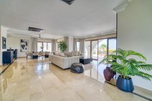 a living room with a couch and a table at Carrington Holidays in Kyrenia