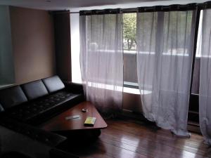 Posezení v ubytování Le Panorachic + 2 fotografie