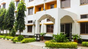 a building with an arch in front of it at Tum Hotel & Conferencing in Mombasa