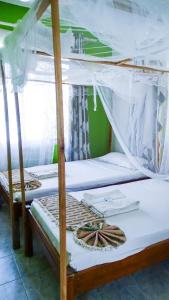 a pair of bunk beds in a room at Tum Hotel & Conferencing in Mombasa