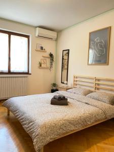 a bedroom with a large bed in a room at 4 Roses Residence VRTNICA in Sečovlje