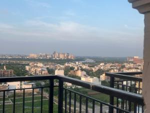a view of a city from a balcony at Moon Path Stay in Nalmatha