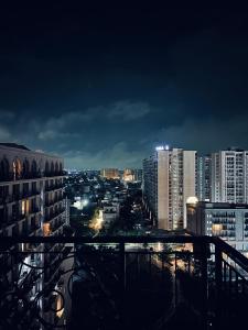 a view of a city at night with buildings at Moon Path Stay in Nalmatha