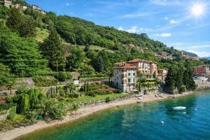 a town on the shore of a river at Villa Marina - Como lake in Bellano +88 photos