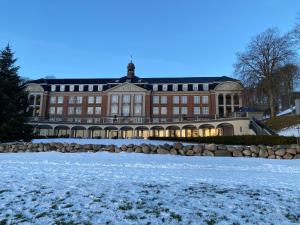 a large brick building with snow in front of it at Panorama udsigt in Kolding +20 photos