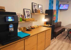 a room with a desk with a laptop on it at Hotel les Tourrades in Cannes