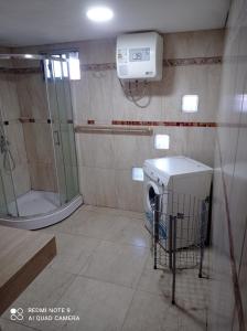 a bathroom with a washing machine and a shower at Casanuestra in San Javier +18 photos