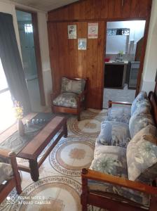 a living room with a couch and a chair at Casanuestra in San Javier