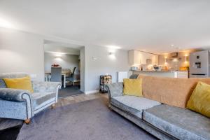 a living room with a couch and two chairs at 2 Bed in Bush oc-s31846 in Bude