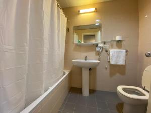 a bathroom with a toilet and a sink at Rabieh Guest house in Rabieh +13 photos