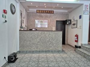 a lobby with a reception counter in a building at Cristal Sinaia in Sinaia