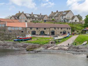 a group of boats parked in front of a building at 3 Bed in Alnwick oc-77571 in Craster