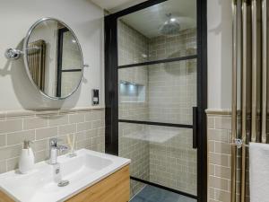 a bathroom with a sink and a shower at 3 Bed in Alnwick oc-77571 in Craster +21 photos