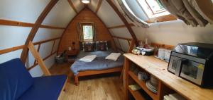 an overhead view of a bedroom in a wooden cabin at Glamping Life Retreat in Nantmel