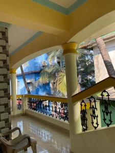 a view of a lobby with a palm tree mural at Cardozo beach house in Calangute