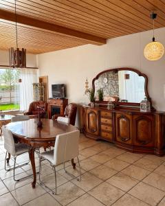 a living room with a table and a mirror at BSG Apartments in Selfoss