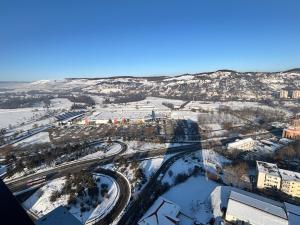 an aerial view of a city in the snow at YANG 23rd Floor Panoramic View & King Bed, Parkin in Cluj-Napoca