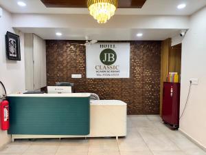 a lobby of a dental office with a reception desk at Hotel Jb Classic in Himatnagar