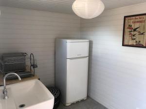 a kitchen with a white refrigerator and a sink at Marée Ault - Maison de ville échappée mer in Ault