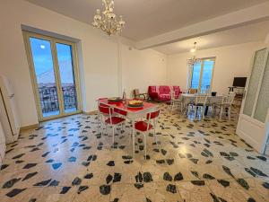 a living room with a table and chairs and windows at B&B - Studio Arcodia in San Marco dʼAlunzio +34 photos