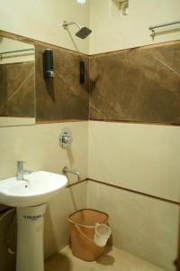 a bathroom with a sink and a mirror at Aastha view inn in Amritsar +7 photos