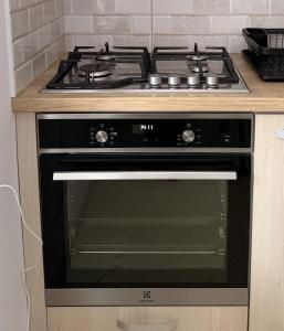 a stove top oven sitting in a kitchen at Villa J'adore in Crasna +21 photos