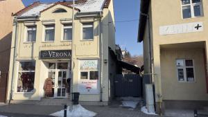 a building with a sign on the front of it at My Central Home in Miercurea-Ciuc