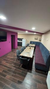 a room with a couch and a table and chairs at Hotel17 in Belogradchik