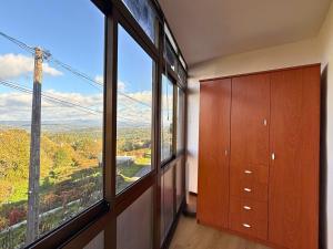 a room with a large window with a view at YourHouse Casa Antonio in Sobrado del Obispo