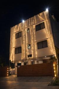a building with lights on it at night at Manas homes in Gwalior