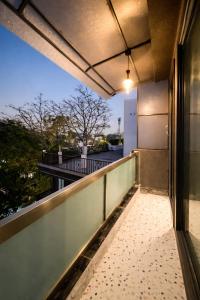 a balcony with a view of a street at The Boutique Studio Near Green Park Delhi- By ACESTAYZ in New Delhi