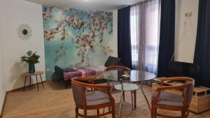 a living room with a table and a couch at Art House Plovdiv in Plovdiv