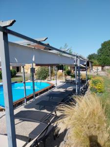 a patio with a swimming pool and a building at Sharecroppers Cottage with Swimming Pool in Pagéas