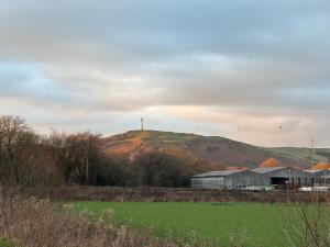 a cross on top of a hill with a building at May Townhouse in Ulverston