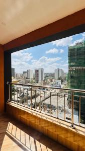 a balcony with a view of a city at Alya Hotel & Suites Ltd in Nairobi