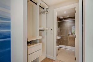 a bathroom with a shower and a toilet and a sink at 2 Bed in Padstow oc-28108 in Padstow +23 photos