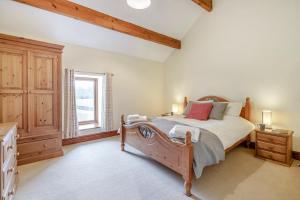 a bedroom with a large bed and a window at 2 Bed in Ingleton oc-h34470 in Ingleton