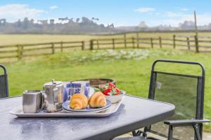 a plate of food on a table with a plate of food at 2 Bed in Ingleton oc-h34470 in Ingleton