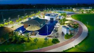 an aerial view of a building with umbrellas at Casa em clube in São José de Ribamar