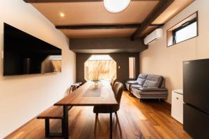 a living room with a table and a couch at 三十三Kumo in Kyoto
