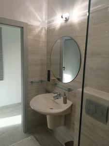a bathroom with a sink and a mirror at Przystań Nadole in Nadole +20 photos