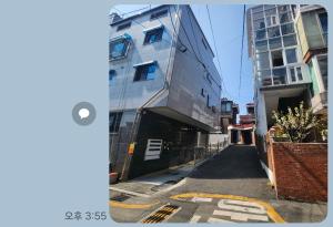 a building on a street next to a building at Sillim's Rest Area in Seoul